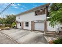 Two-story house with attached garage and driveway, daytime view at 832 13Th N Ave, St Petersburg, FL 33701