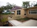 House exterior showcasing a welcoming walkway and gate at 1018 E Hanna Ave, Tampa, FL 33604