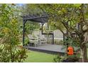 Relaxing backyard oasis with pergola and deck at 1217 E Flora St, Tampa, FL 33604