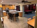 Eat-in kitchen with island and views of the game room at 13986 Bonnie Brae Dr, Largo, FL 33774