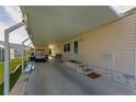 Side view of carport, showing access to the manufactured home at 18675 Us Highway 19 N # 364, Clearwater, FL 33764