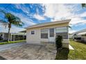 Front view of a tan single-wide manufactured home with stone steps at 18675 Us Highway 19 N # 364, Clearwater, FL 33764