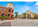 Brick building exterior with palm trees and street view at 1910 E Palm Ave # 8214, Tampa, FL 33605