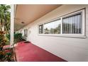 Building exterior, walkway, tropical plants at 2071 Australia W Way # 17, Clearwater, FL 33763