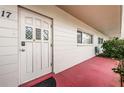 White front door with decorative glass at 2071 Australia W Way # 17, Clearwater, FL 33763