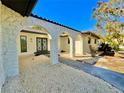 Stone entryway with arched details and double doors at 2142 Hickory Gate W Dr, Dunedin, FL 34698