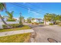 Gated community entrance with landscaping and signage at 231 S Mcmullen Booth Rd # 54, Clearwater, FL 33759