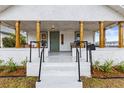 Inviting front porch with wooden posts and seating at 2860 4Th S Ave, St Petersburg, FL 33712