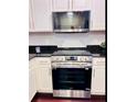 Stainless steel LG range and microwave in a bright kitchen at 3417 Dragon View Ct # 3417, Valrico, FL 33594