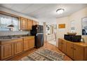 Bright kitchen with wood cabinets and black appliances at 5149 Jo St, Zephyrhills, FL 33542