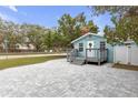 Front view of charming light blue house with gray deck at 5161 Rena N St, St Petersburg, FL 33709