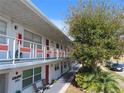 Side view of a two-story building with balconies and landscaping at 5920 18Th N St # 21, St Petersburg, FL 33714