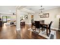 Open dining room with dark wood floors and granite table at 808 W Hollywood St, Tampa, FL 33604