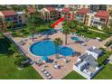 Aerial view of condo unit near resort-style pool at 845 S Gulfview Blvd # 208, Clearwater Beach, FL 33767