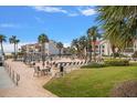 Relaxing pool area with lounge chairs and patio furniture at 845 S Gulfview Blvd # 208, Clearwater Beach, FL 33767