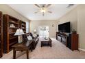 Spacious living room featuring a comfortable leather couch and built-in shelving at 10010 Bucklin St, Tampa, FL 33625