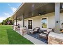 Relaxing covered porch with wicker furniture at 11307 Wagon Trail Run, Lithia, FL 33547