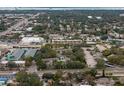 Wide shot of condo community near roads and businesses at 2375 Lake Heather Heights Ct # 202, Dunedin, FL 34698