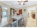 Elegant dining room with a table for four and views into kitchen and living areas at 2545 2Nd N Ave, St Petersburg, FL 33713