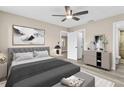 Bright bedroom with ceiling fan and neutral walls at 3833 Lighthouse Way, New Port Richey, FL 34652