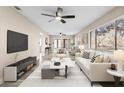 Bright and airy living room with contemporary furnishings and large windows at 3833 Lighthouse Way, New Port Richey, FL 34652