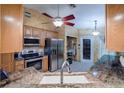 Kitchen boasts granite countertops and stainless steel appliances at 4228 Spring Way Cir, Valrico, FL 33596