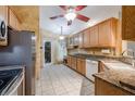 Spacious kitchen with wood cabinets, granite countertops, and stainless steel appliances at 4228 Spring Way Cir, Valrico, FL 33596