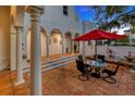 Outdoor patio with seating area, fountain, and arched entryway at 4845 W Sunset Blvd, Tampa, FL 33629