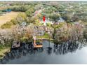 Aerial view showcasing a home's waterfront location and private dock at 5649 Glencrest Blvd, Tampa, FL 33625