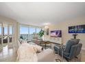 Bright living room featuring water views and comfy furniture at 5700 Escondida S Blvd # 302, St Petersburg, FL 33715