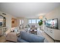 Spacious living room with water views and comfortable seating at 5700 Escondida S Blvd # 302, St Petersburg, FL 33715