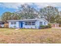 Updated light blue house with a tidy front yard at 674 61St S Ave, St Petersburg, FL 33705