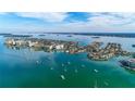 Aerial view of waterfront community with boats and homes at 690 Island Way # 410, Clearwater Beach, FL 33767