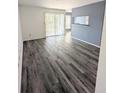 Gray walls and wood-look floors in condo living room at 8702 Mallard Reserve Dr # 104, Tampa, FL 33614