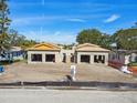 Under construction duplex with attached garages, from aerial view at 126 Ricardo Ne Way, St Petersburg, FL 33704