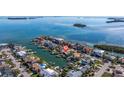 Aerial view of a waterfront home with private dock and canal access at 127 Sands Point Dr, Tierra Verde, FL 33715