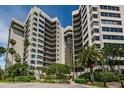 Elegant beachfront condo building with tropical landscaping at 1600 Gulf Blvd # 417, Clearwater Beach, FL 33767