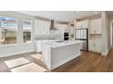 Modern kitchen with white cabinets and island at 1742 W Saint Louis St, Tampa, FL 33607
