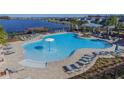 Resort-style pool with lounge chairs and a water feature at 18865 Deer Tracks Loop, Lutz, FL 33558