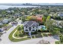 Luxury home with pool, waterfront view, and lush landscaping at 200 Cordova Ne Blvd, St Petersburg, FL 33704