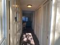 Bright entryway with coat closet and view into the living area at 2285 Israeli Dr # 1, Clearwater, FL 33763