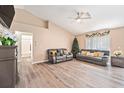 Bright living room with hardwood floors and a view of the bathroom at 2397 Ainsworth Ave, Spring Hill, FL 34609