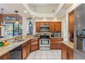 Spacious kitchen with granite countertops and stainless steel appliances at 3457 Foxhall Dr, Holiday, FL 34691