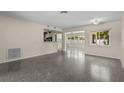 Spacious living area with terrazzo floors and open floor plan at 593 39Th Ave, St Pete Beach, FL 33706