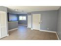 Living room with tile floors and neutral-colored walls at 7298 Ulmerton Rd # 202, Largo, FL 33771