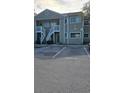 Condo building with parking lot in front at 7298 Ulmerton Rd # 202, Largo, FL 33771