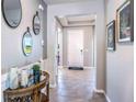 Bright entryway with tile flooring and decorative wall mirrors at 10585 Bridgegate Heights Loop, San Antonio, FL 33576