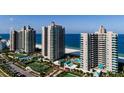 Aerial view of luxurious beachfront condos with resort amenities at 1520 Gulf Blvd # 1404, Clearwater Beach, FL 33767