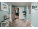 Bright condo entry with hardwood floors and coastal decor at 1520 Gulf Blvd # 1404, Clearwater Beach, FL 33767