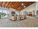 Spacious common area with vaulted ceilings, comfortable seating, and ocean views at 1660 Gulf Blvd # Ph1, Clearwater Beach, FL 33767